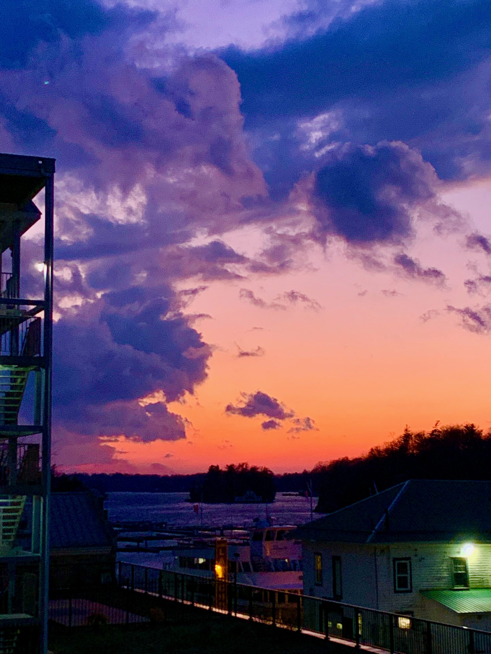 Purple and orange sunset over an island.